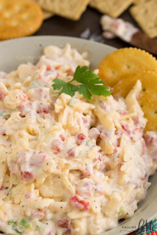 Using gouda cheese instead of the traditional cheddar in Gouda Pimento Cheese gives this recipe a delicious twist. Pimento Cheese is a popular Southern spread consisting of cheese, pimento peppers, mayonnaise, and seasonings. This cheesy spread can be used in a sandwich, or a grilled sandwich, to top burgers, or as a dip with crackers. It can be eaten hot or cold. And, it's great for picnics and tailgating. Gouda Pimento Cheese