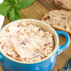 Strawberry Butter is fluffy, creamy, and slightly sweet. Made with just two ingredients Strawberry Butter is great on quick bread, yeast bread, biscuits, pancakes, toast, scones, and rolls.