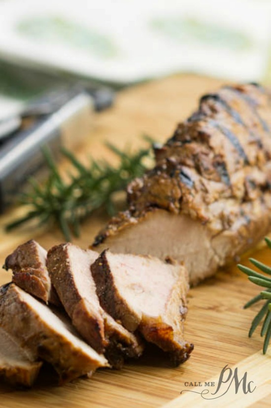 Molasses Glazed Pork Tenderloin has a sweet and savory marinade that adds a beautiful flavor to this recipe. It's juicy, tender, and versatile. Molasses-glazed roasted pork tenderloin is sliced on a wooden board and beautifully garnished with fresh rosemary sprigs.
