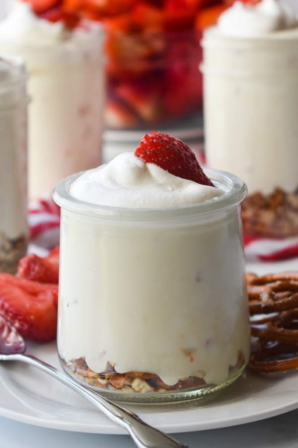 Super easy and quick to prepare, No Cook Strawberry Cheesecake is a true winner and always a crowd pleaser! It's rich, creamy, sweet, and so refreshing! #nocook #nobake #cheesecake #strawberry #fruit #sweetenedcondensedmilk #whippedcream #dessert #recipe Strawberry Cheesecake