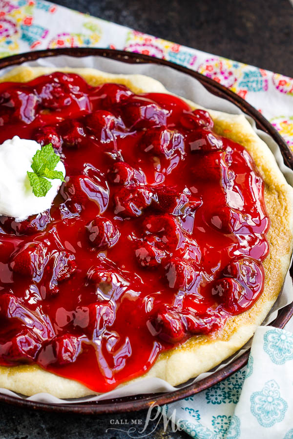 An easy recipe for a delicious dessert, Strawberry Cheesecake Pizza Recipe has a really yummy pizza crust topped with sweetened cream cheese and strawberry pie filling. #pizza #dessert #recipe #dessertpizza #strawberry #callmepmc Strawberry Cheesecake Pizza