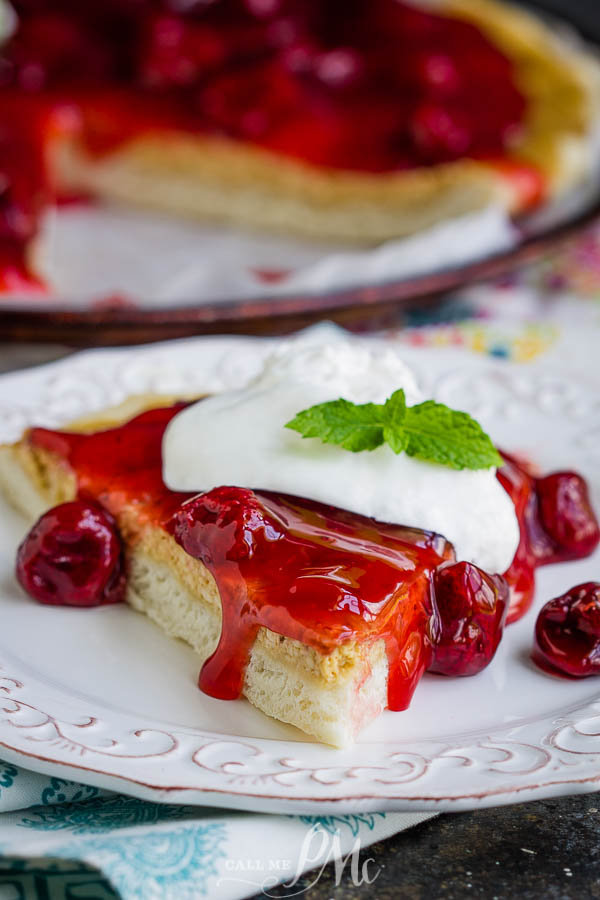An easy recipe for a delicious dessert, Strawberry Cheesecake Pizza Recipe has a really yummy pizza crust topped with sweetened cream cheese and strawberry pie filling. #pizza #dessert #recipe #dessertpizza #strawberry #callmepmc Strawberry Cheesecake Pizza