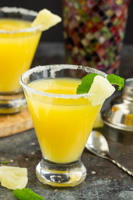 Sweet and festive, a Pineapple Martini is a crazy delicious tropical inspired martini. Sweet and festive cocktail.