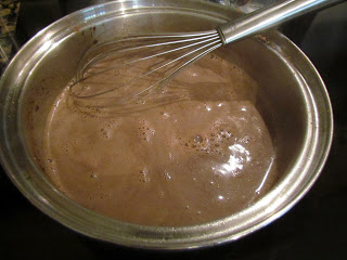 whisking lumps out of gravy.