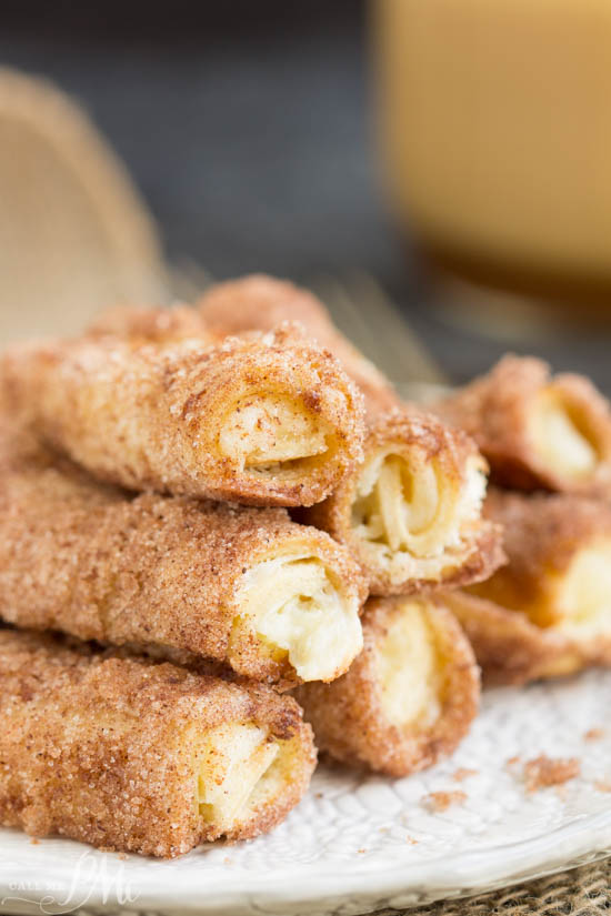 Cream Cheese Cinnamon Rollups is a sweet creamy filling rolled between layers of crust with a light dusting of a cinnamon-sugar coating. Cinnamon cream cheese rollups on a white plate.