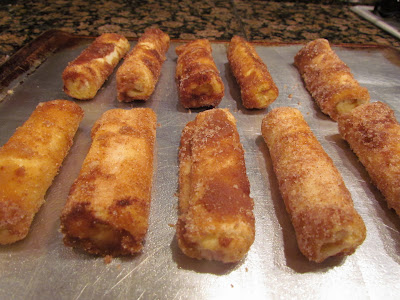 baked cinnamon sugar cream cheese stuffed roll ups.