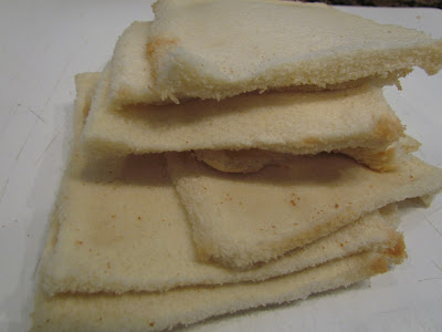 Crustless white bread slices.