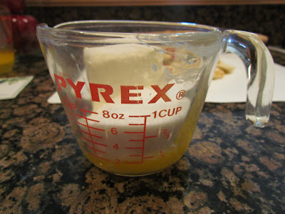 melted butter in glass measuring cup.