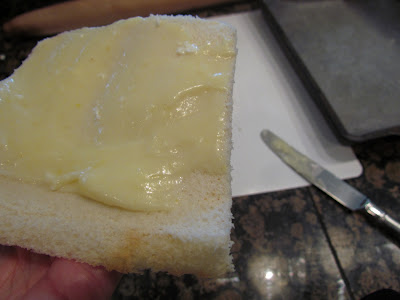 preparing cheese rollups on white bread