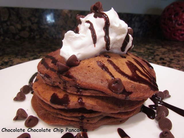 A chocolate lover's dream, these Chocolate Chocolateย Chip Pancakes are extra thick and made with just a few basic ingredients.ย Chocolate pancakes with chocolate syrup