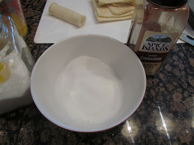 making cinnamon sugar in a small white bowl