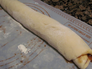 rolling sweet dough filled with cinnamon.