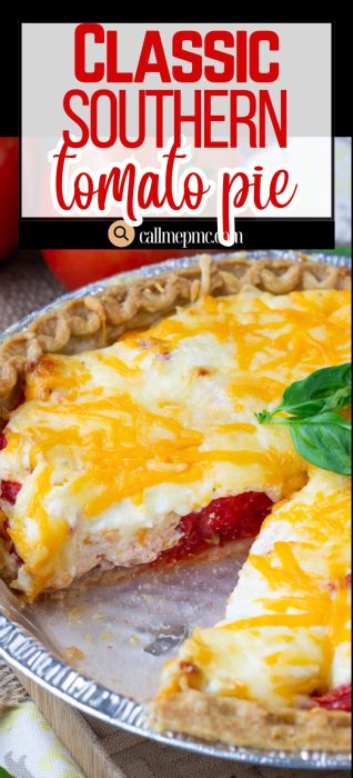 A sliced Southern Tomato Pie topped with melted cheese sits in a metal pie tin, revealing delicious layers of tomato and cheese inside.