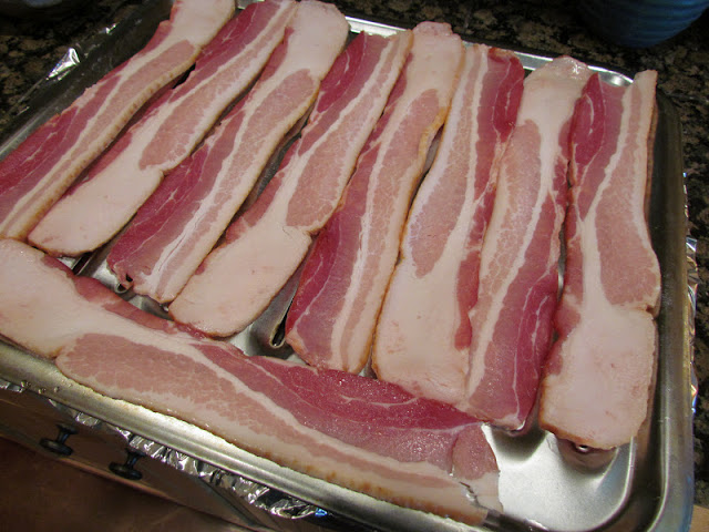 raw bacon on sheet pan