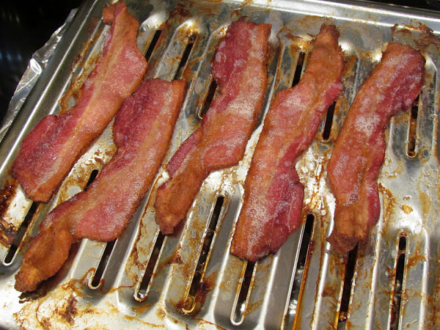 cooked bacon on sheet pan