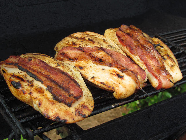 bacon wrapped chicken on grill