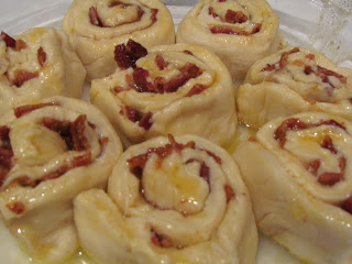 Bacon Breakfast Rolls with Maple Glaze uncooked cinnamon bacon rolls in a pan