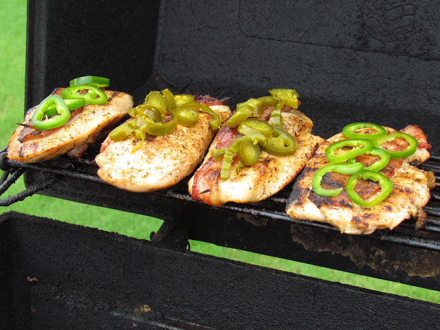 chicken on grill with bacon and jalapenos