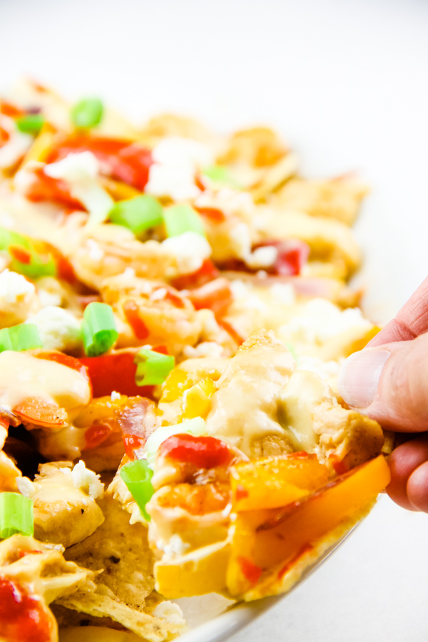 Chicken Shrimp Fajita Nachos are delicious when layered with all the good stuff chicken, shrimp, peppers, onions, and cheese. #chicken #shrimp #fajita #nachos Chicken Shrimp Fajita Nachos