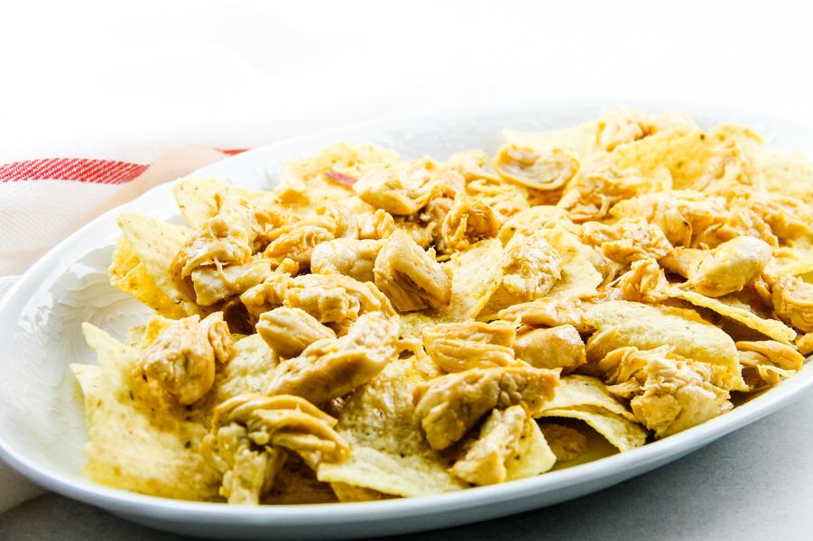 Chicken Shrimp Fajita Nachos are delicious when layered with all the good stuff chicken, shrimp, peppers, onions, and cheese. #chicken #shrimp #fajita #nachos Chicken Shrimp Fajita Nachos