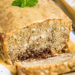 Packed with peanut butter, this Peanut Butter Bread is a decadent, slightly, sweet quick bread that's perfect for breakfast, snacking, or dessert! #bread #dessert #pecans #recipe #peanutbutter