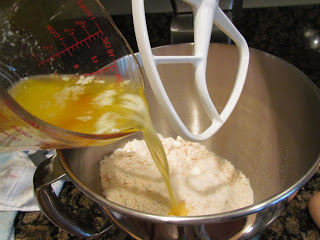 adding melted butter to peanut butter bars batter