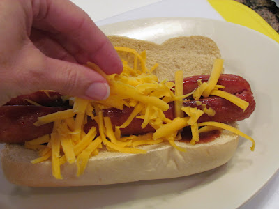 dressing the sausage dog with cheese