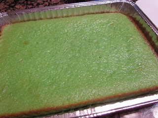 green cake baked in an aluminum pan.