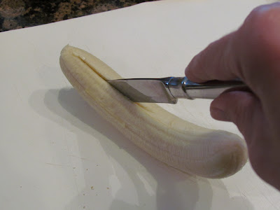 Sliced Bananas on a white surface.