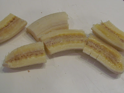 Sliced Bananas on a white surface.
