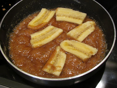 Caramel sauce and bananas in a skillet.