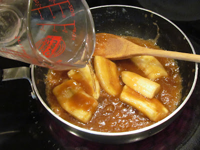Caramel sauce and bananas in a skillet.