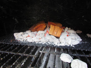 pecan wood chips on top of charcoal.