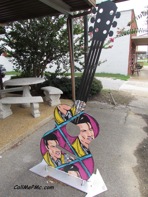 Elvis Inspired Guitar outside Johnnie's drive-in