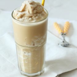 a glass of coffee and caramel smoothie