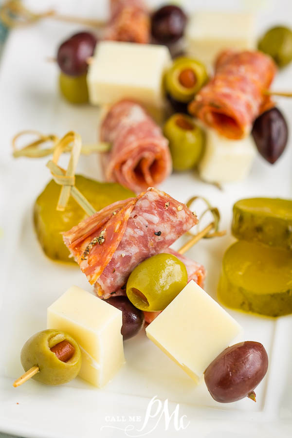 CHARCUTERIE ON A STICK Appetizers on a white plate.