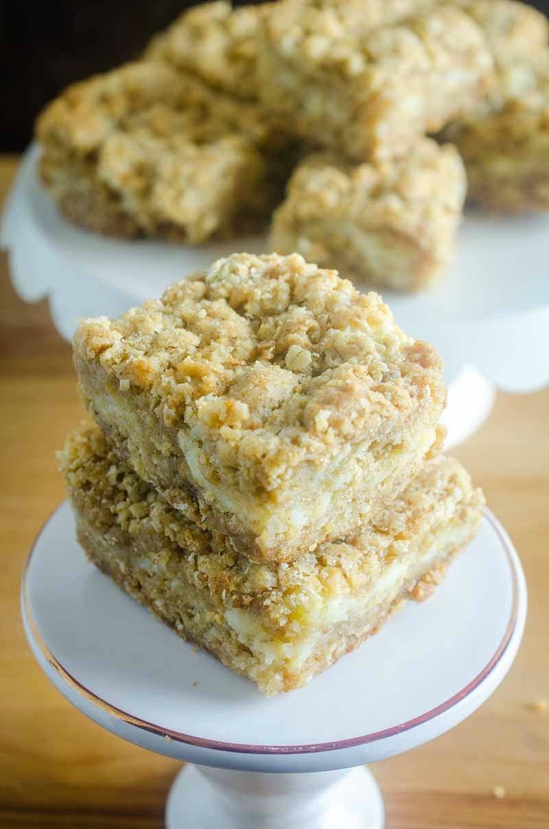 An oatmeal cookie and cheesecake collide in this Oatmeal Cookie and Cream Cheese Bars recipe. They are luscious, sweet, and can be made quickly and easily. #dessert #recipe #creamcheese #oats An oatmeal cookie and cheesecake collide in this Oatmeal Cookie and Cream Cheese Bars