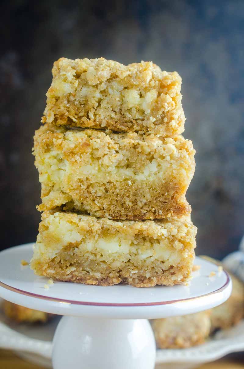 An oatmeal cookie and cheesecake collide in this Oatmeal Cookie and Cream Cheese Bars recipe. They are luscious, sweet, and can be made quickly and easily. #dessert #recipe #creamcheese #oats An oatmeal cookie and cheesecake collide in this Oatmeal Cookie and Cream Cheese Bars
