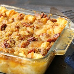Pecan Pie Bread Pudding from callmepmc.com combining 2 classics this bread pudding dessert has a rich pecan pie topping.