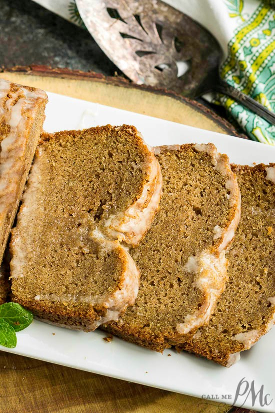 This homemade Cinnamon Roll Breakfast Bread is moist, tender, and incredibly easy to make. This quick bread doesn't have yeast and can be ready in about an hour. #bread #dessert #breakfast cinnamon bread sliced on a tray.