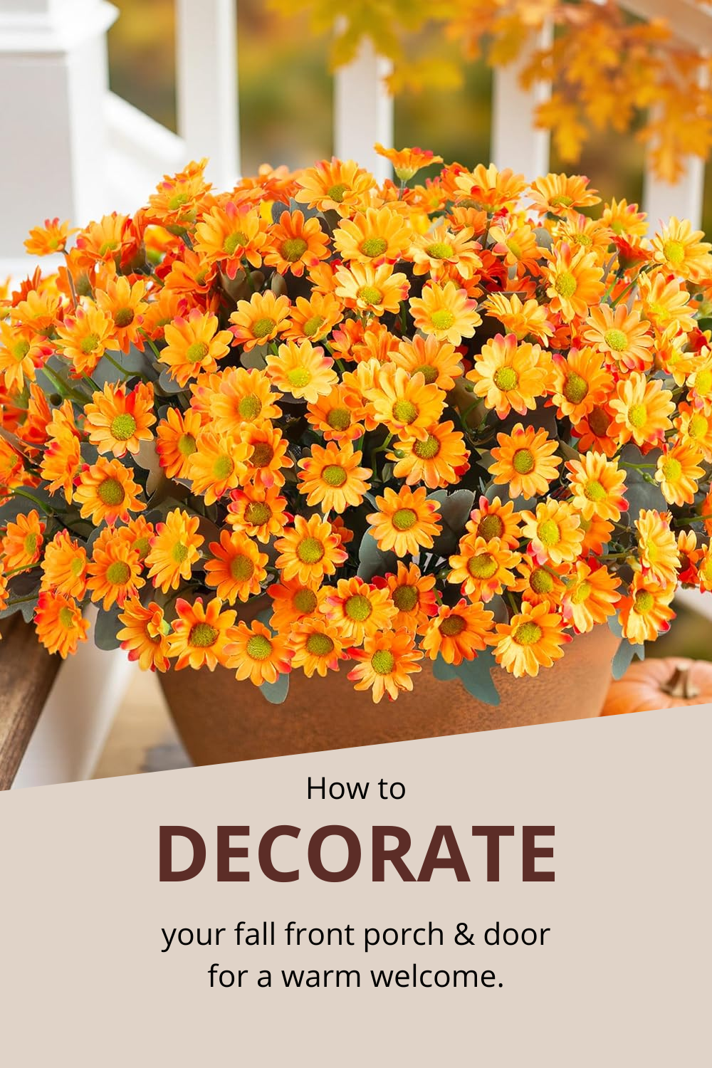 A potted arrangement of orange and yellow flowers sits on a porch, adding fall color, with text below that reads, "How to decorate your fall front porch & door for a warm welcome.
