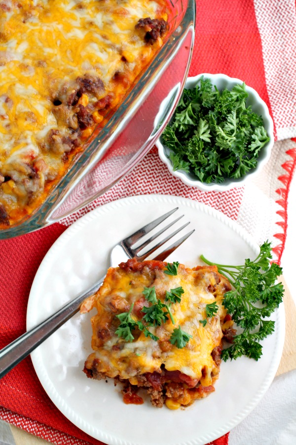 Tamale Pie recipe is quick and easy to make. A spicy beef mixture with Mexican flavors sits on top of creamy grits and replicates the familiar tamale taste an texture. #tamales #casserole #tamalepie #TexMex #recipe Tamale Pie