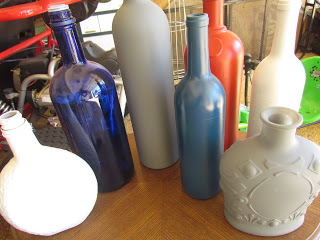 first coat of paint on wine bottles