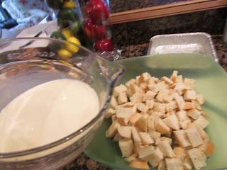 A bowl of croutons next to a bowl of pecan pie bread pudding.