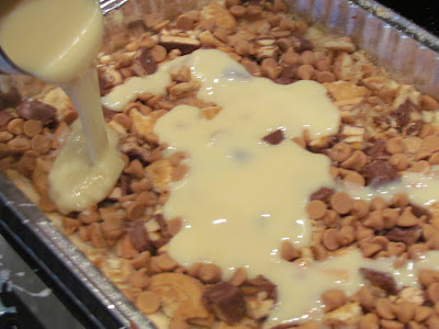 A tray of peanut butter chips being poured with icing sweetened condensed milk.