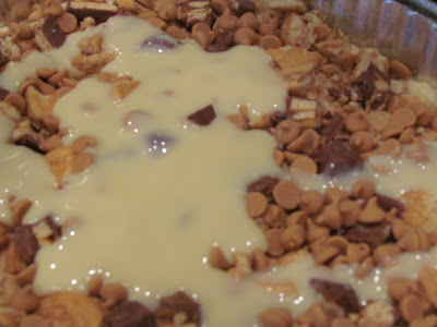 A baking dish with peanut butter chips and sauce.