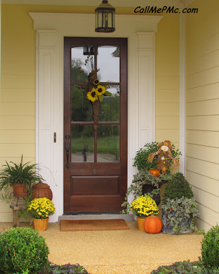 Adding fall color to front door of a house.