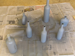 wine bottles sprayed with primer paint