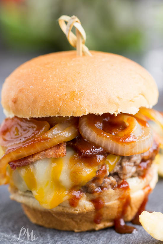 The ultimate burger recipe, Bourbon Burgers, are smothered with cheddar cheese, bacon, caramelized onions and bourbon barbecue sauce!