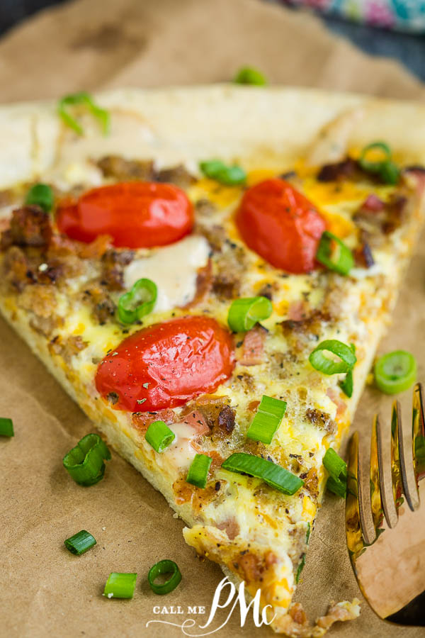 slice of Italian pie with sausage, eggs, tomatoes Easy Breakfast Pizza